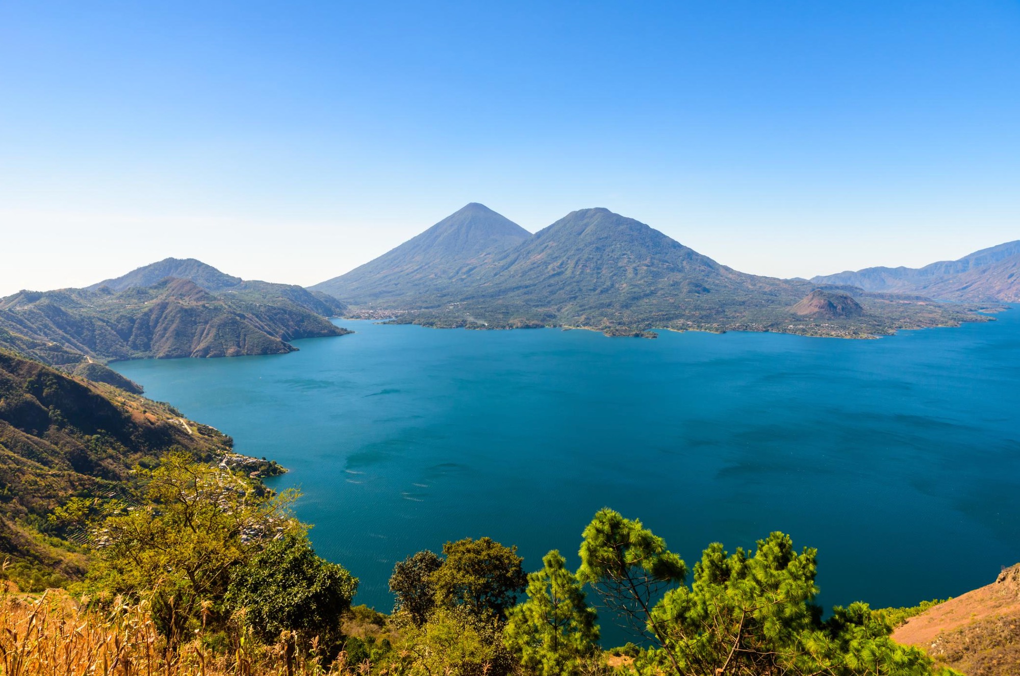 Wide view of Lake Atitlán and surrounding volcanoes