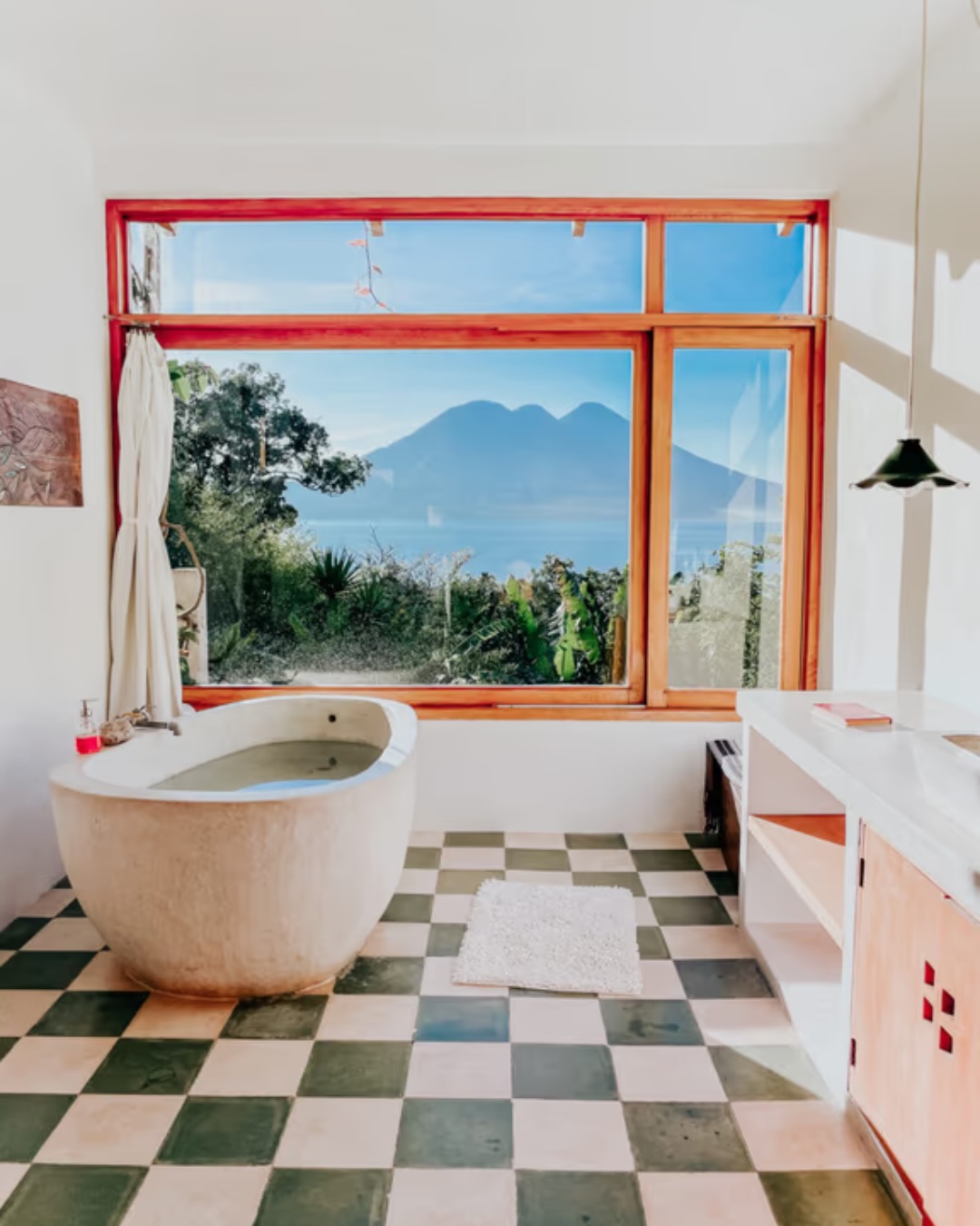 Bathtub with lake and volcano views